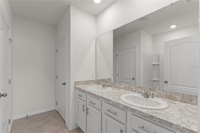 bathroom with vanity and tile patterned floors