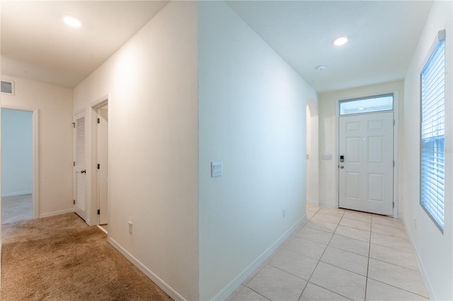 hall with light tile patterned flooring