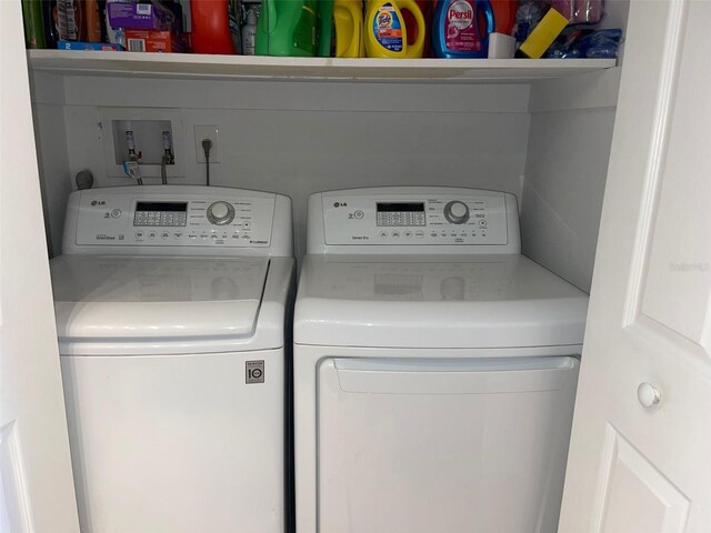 washroom with washer and dryer
