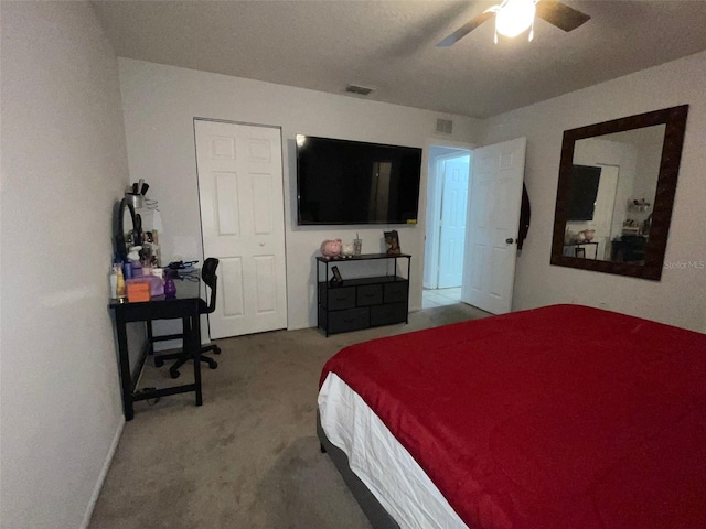 bedroom with ceiling fan and carpet flooring