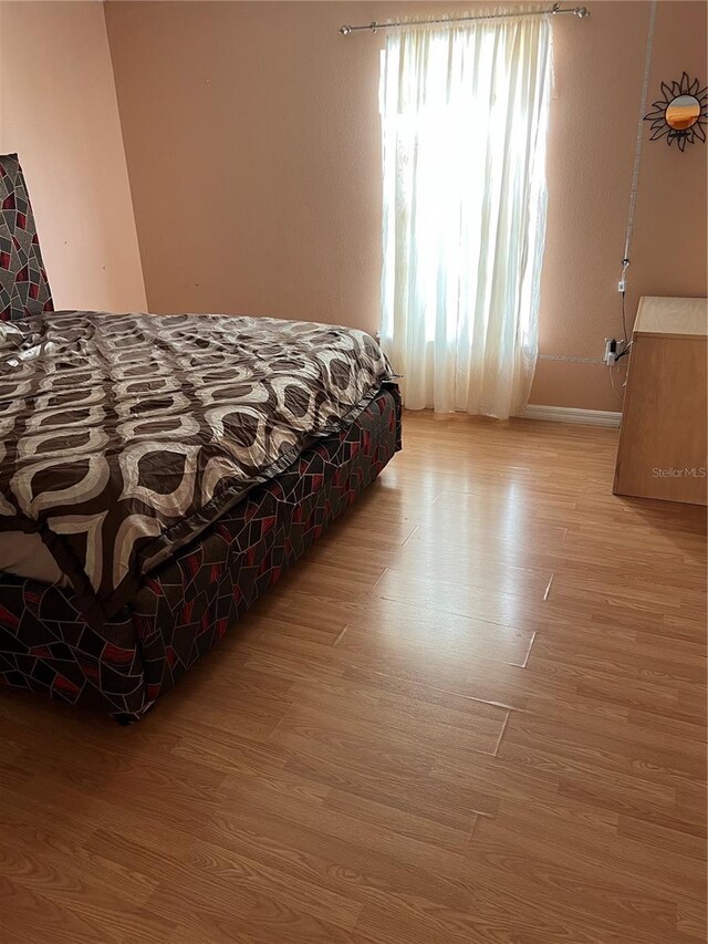 350 Corsica Ct, Kissimmee, FL 34758 - bedroom with light wood-style flooring