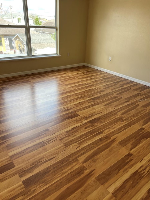 350 Corsica Ct, Kissimmee, FL 34758 - empty room featuring dark wood-style flooring and baseboards