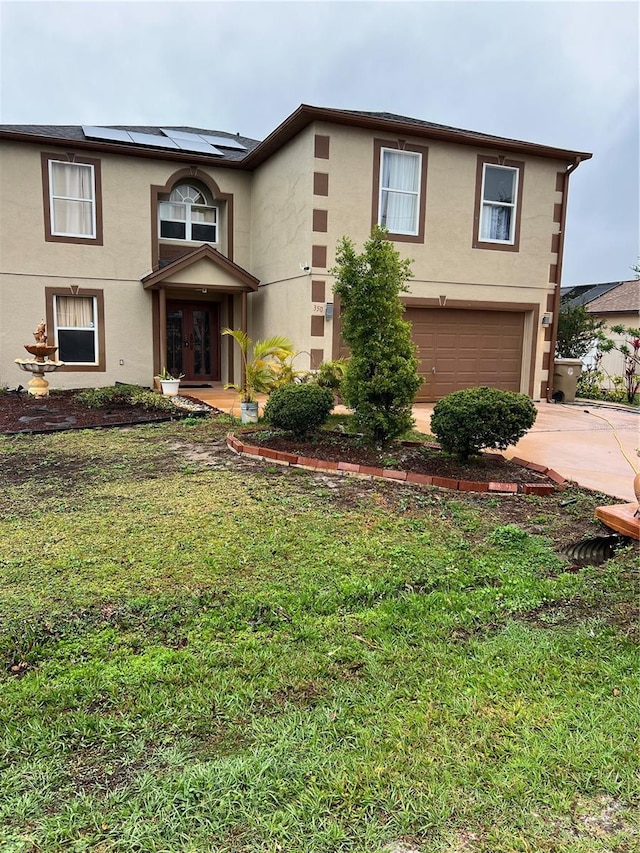350 Corsica Ct, Kissimmee, FL 34758 - view of front of home featuring an attached garage, driveway, and stucco siding