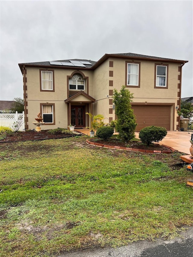 350 Corsica Ct, Kissimmee, FL 34758 - view of front facade featuring an attached garage, fence, driveway, and stucco siding