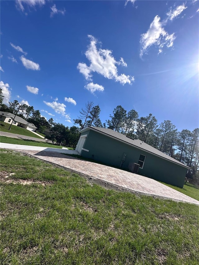 6430 SW 144th Street Rd, Ocala, FL 34473 - view of home's exterior with a yard and a patio area