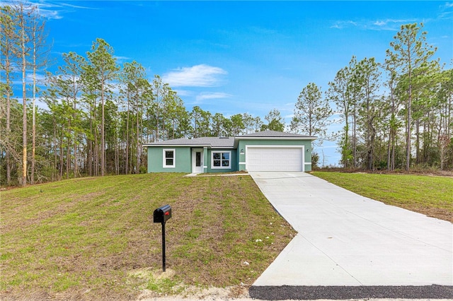 6430 SW 144th Street Rd, Ocala, FL 34473 - view of front of home with an attached garage, driveway, stucco siding, and a front lawn