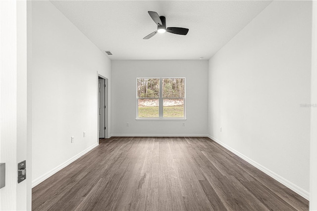 6430 SW 144th Street Rd, Ocala, FL 34473 - empty room featuring dark wood finished floors, a ceiling fan, and baseboards