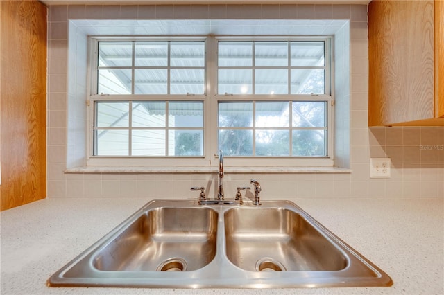 interior details with sink and backsplash