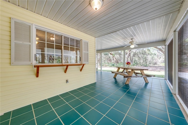 sunroom / solarium featuring wood ceiling