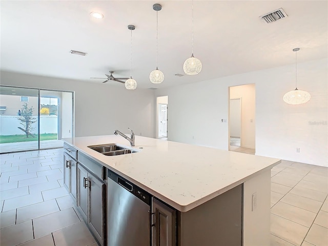 kitchen with dishwasher, sink, pendant lighting, and an island with sink