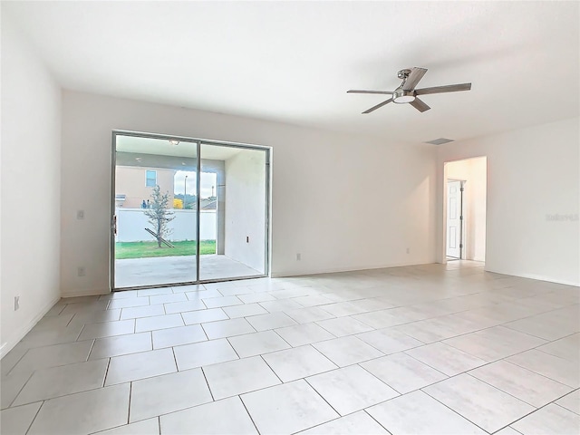 spare room featuring ceiling fan and light tile patterned flooring