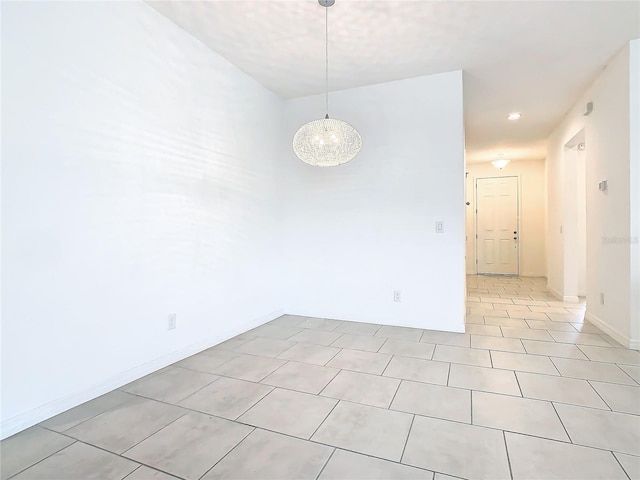 spare room featuring light tile patterned floors