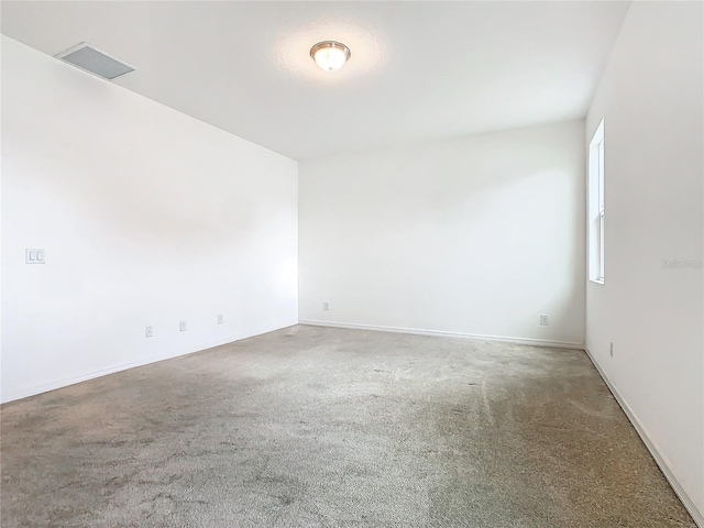 unfurnished room with carpet flooring