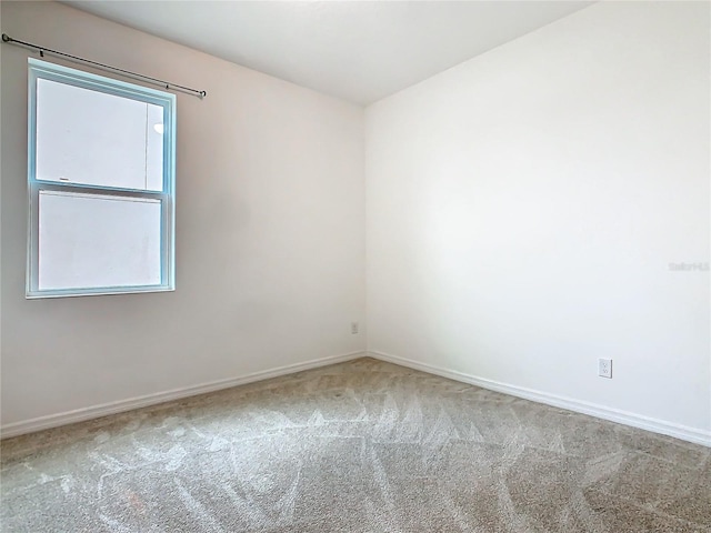 empty room with carpet flooring