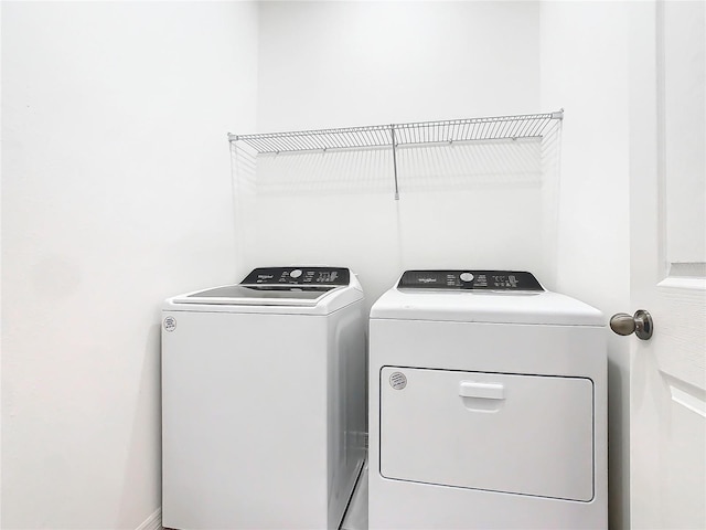 washroom featuring separate washer and dryer