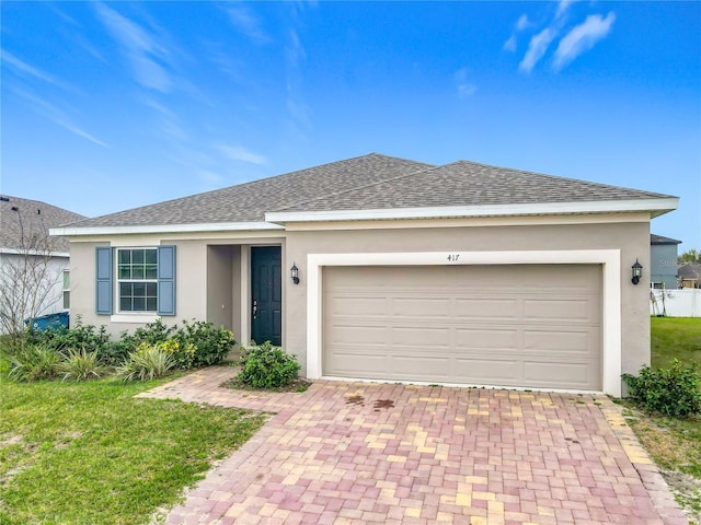 single story home featuring a garage