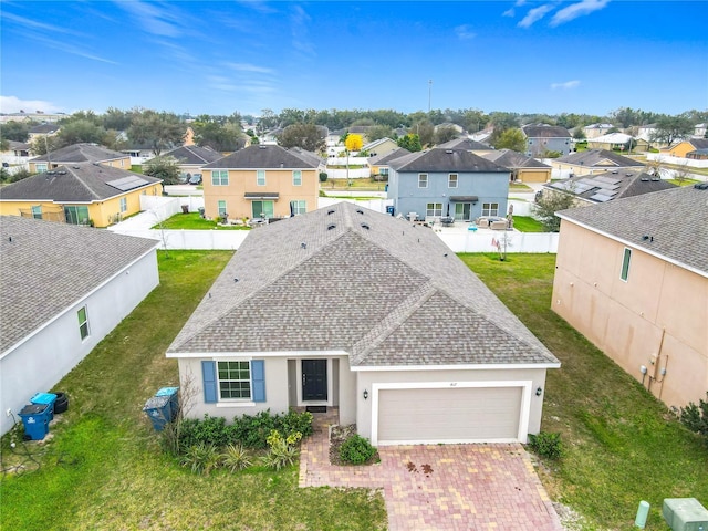 view of front of home with a garage and a front yard