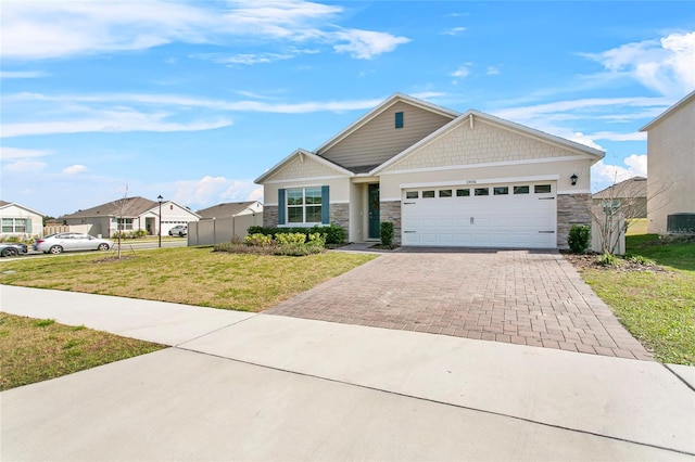 view of front of property featuring a garage and a front yard