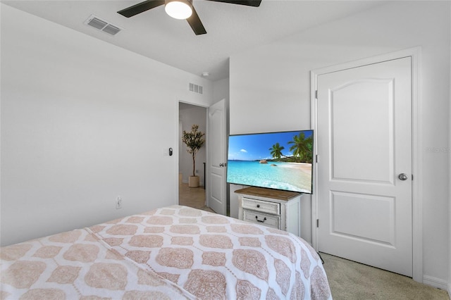 carpeted bedroom featuring ceiling fan