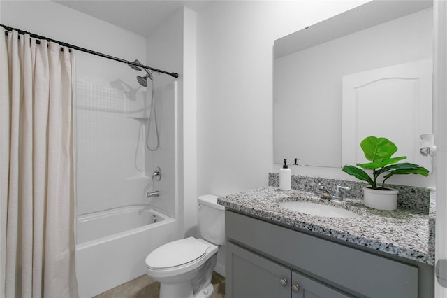 full bathroom featuring vanity, shower / bath combo, and toilet