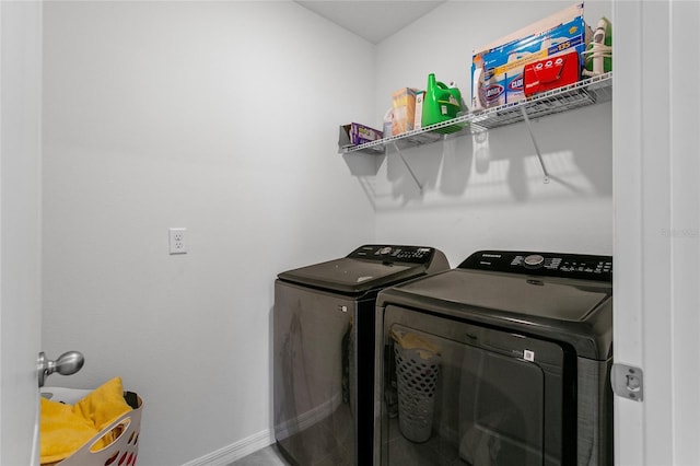 clothes washing area featuring independent washer and dryer