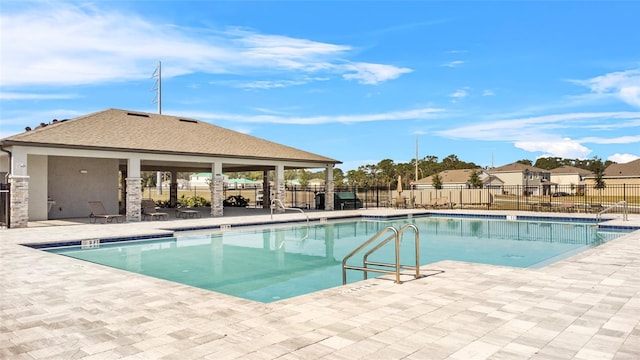 view of swimming pool with a patio area