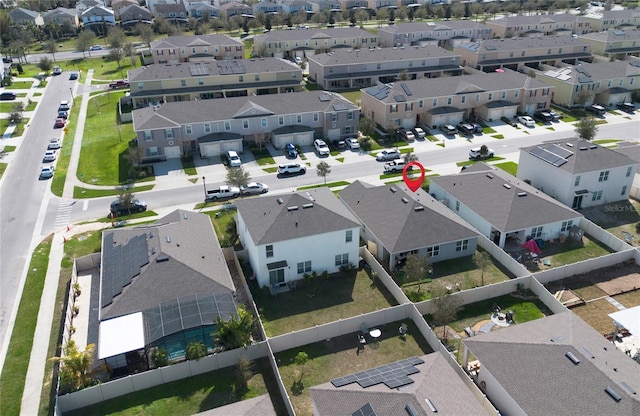 birds eye view of property with a residential view