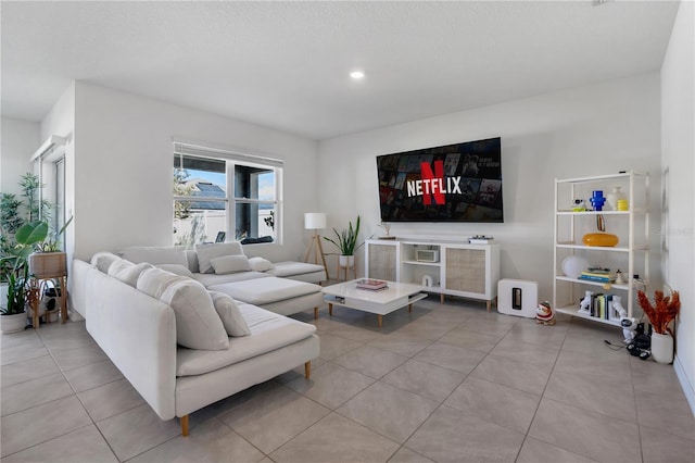 living room with light tile patterned floors and recessed lighting