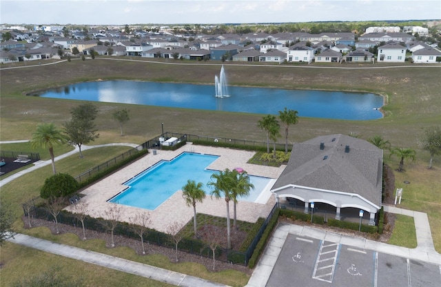 birds eye view of property featuring a residential view and a water view