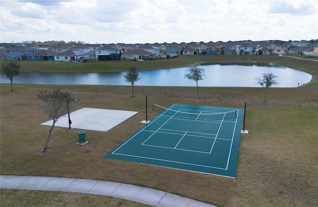 view of property's community with a residential view, a water view, and a tennis court