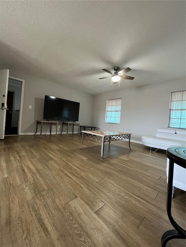 playroom with a wealth of natural light and hardwood / wood-style floors