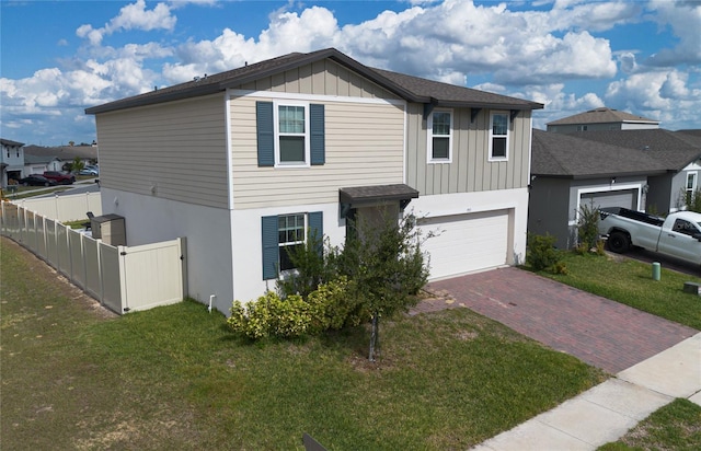 view of front of house with a front lawn and a garage