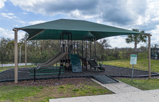 view of playground featuring a lawn