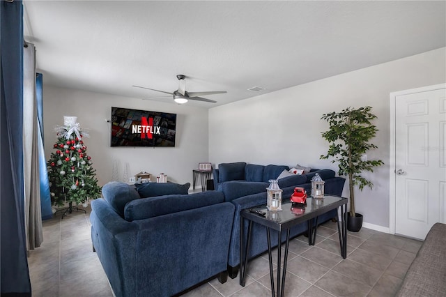 living room with tile patterned flooring and ceiling fan