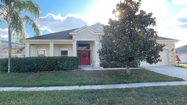 view of front of house with a garage and a front lawn