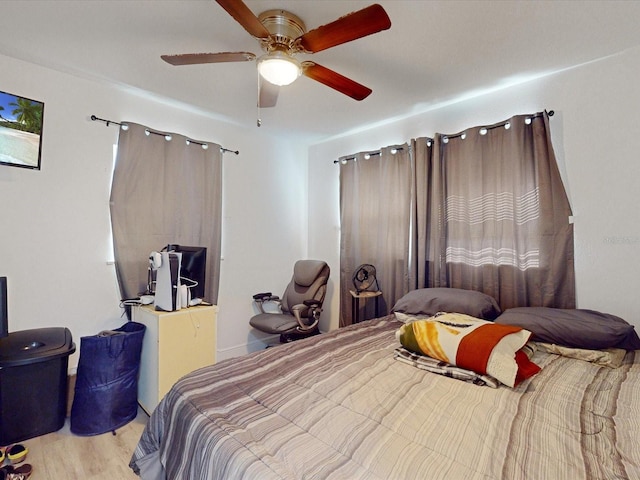 bedroom featuring ceiling fan and light hardwood / wood-style flooring