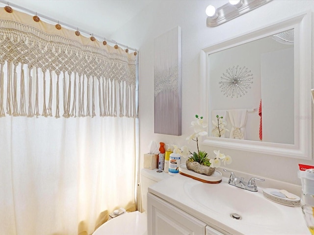 bathroom with vanity and toilet