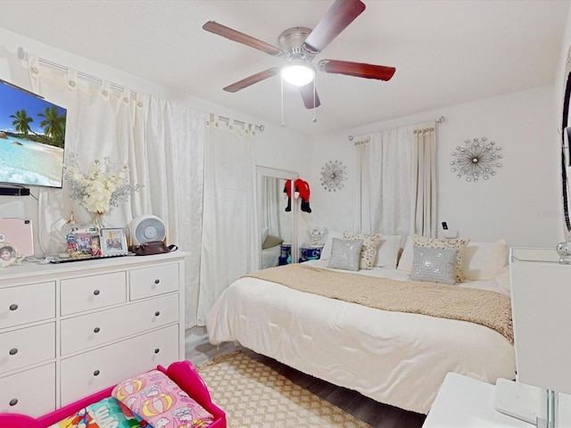 bedroom featuring hardwood / wood-style flooring and ceiling fan