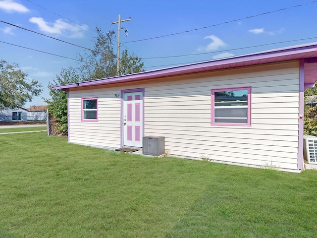 view of outdoor structure with a lawn