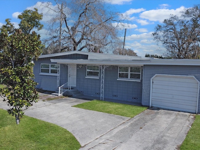 single story home with a garage and a front yard