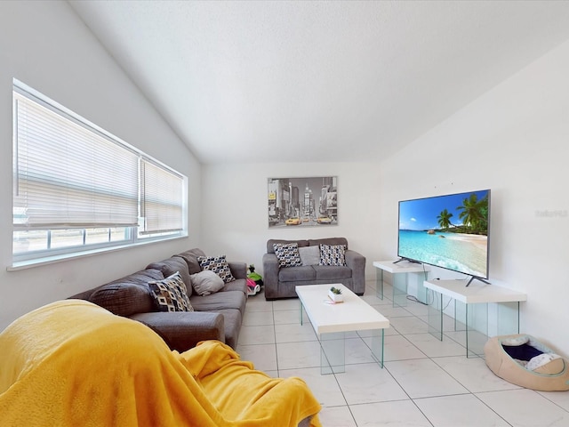 tiled living room featuring vaulted ceiling