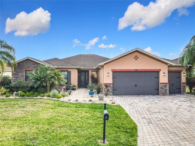 ranch-style house with a garage and a front yard