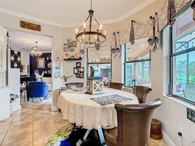 tiled dining space with an inviting chandelier and ornamental molding