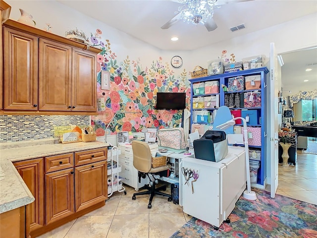 home office featuring light tile patterned floors and ceiling fan