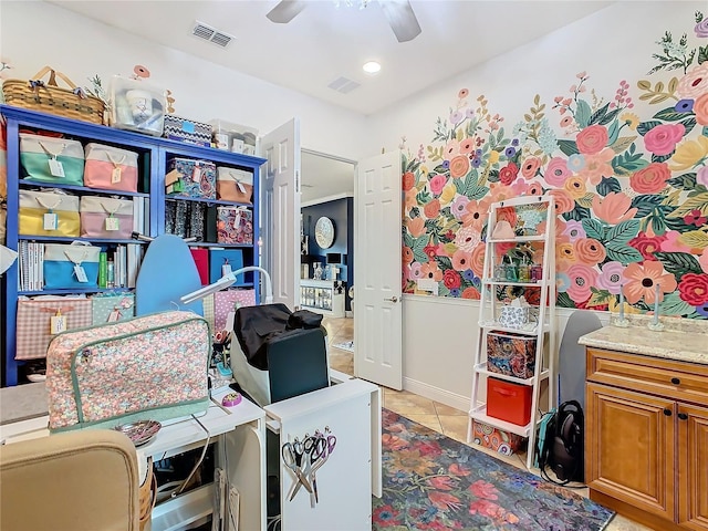 tiled home office featuring ceiling fan