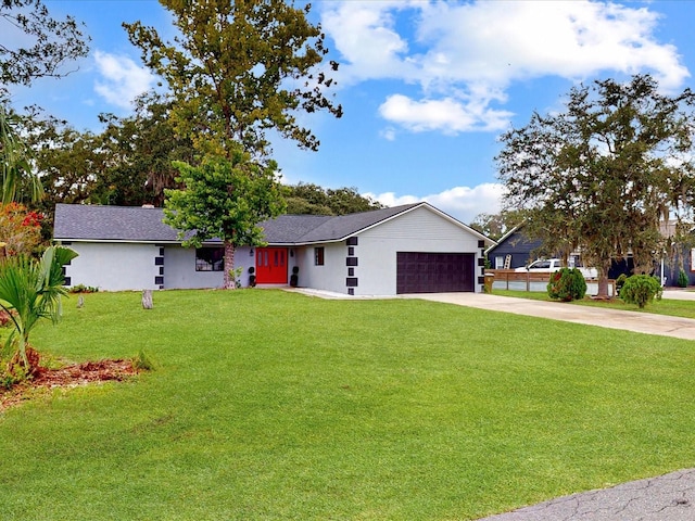 ranch-style house with a garage and a front lawn