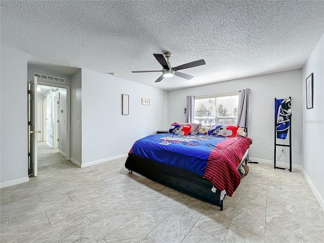 10409 Laxton St, Orlando, FL 32824 - bedroom with a ceiling fan, baseboards, and a textured ceiling
