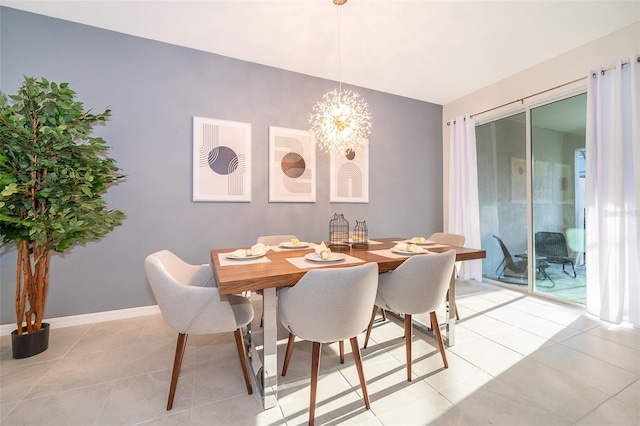 dining room featuring light tile patterned flooring and a notable chandelier