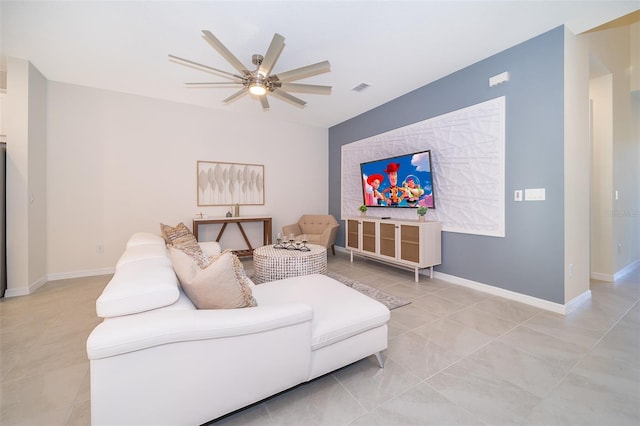 tiled living room with ceiling fan