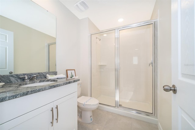 bathroom with vanity, an enclosed shower, and tile patterned flooring